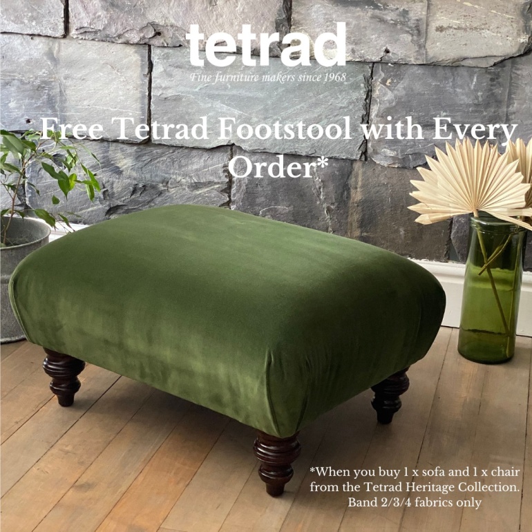 Green velvet footstool with wooden legs in stylish living room